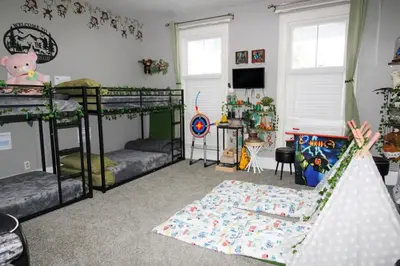 a room with two bunk beds and a rug at The Wilderness, Near CP & SF, W&D, Pet OK in Sandusky