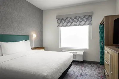 a hotel room with a bed and a window at Home2 Suites By Hilton Dry Ridge in Dry Ridge