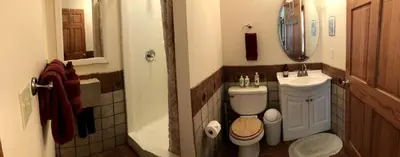 a bathroom with a toilet and a sink at Cozy Studio Cabin Rental with Hot Tub Perfect for Glamping in Ohio in Logan