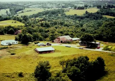 an aerial view of a farm with a barn at Rustic Container Accommodation for Glamping in Kentucky in Owenton