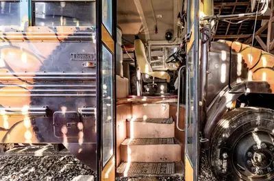 an open door of a bus with stairs in it at Cozy Hot Tub “Love Bus” near Augusta, Kentucky in Germantown