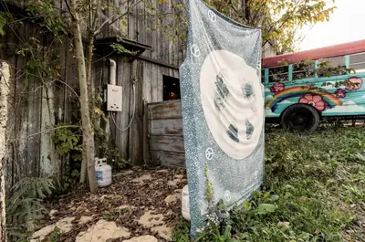 a banner is hanging in front of a bus at Cozy Hot Tub “Love Bus” near Augusta, Kentucky in Germantown