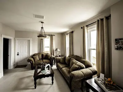 a living room with a couch and two chairs at Charming Weekend Getaway Located on a Vineyard near Cleveland, Ohio in Berlin Center
