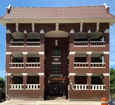 a red brick building with a red roof at Cle Suites 3BR 2BA 5 min Walk to Cle Clinic Unit 1 in Cleveland