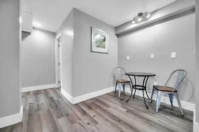 a dining room with a table and chairs at Cle Suites 3BR 2BA 5 min Walk to Cle Clinic Unit 1 in Cleveland