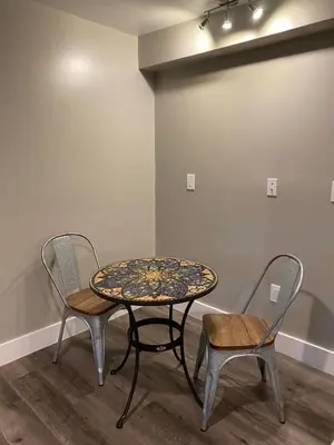 two chairs and a table and a table and chairs at Cle Suites 3BR 2BA 5 min Walk to Cle Clinic Unit 2 in Cleveland