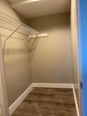 an empty room with a closet with a wooden floor at Cle Suites 3BR 2BA 5 min Walk to Cle Clinic Unit 2 in Cleveland
