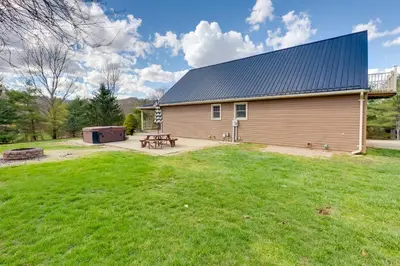 a barn with a picnic table in a yard at Game Room and On-Site Pond Laurelville Retreat! in Laurelville