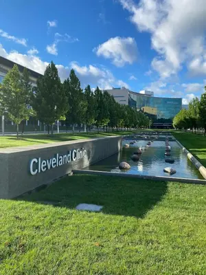 a fountain in front of a building with a sign at Cle Suites 1BR 1BA 5 min Walk to Cle Clinic #7 in Cleveland
