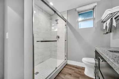 a bathroom with a shower and a toilet at Cle Suites 1BR 1BA 5 min Walk to Cle Clinic #7 in Cleveland