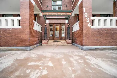 a brick building with a door on the side of it at Cle Suites 1BR 1BA 5 min Walk to Cle Clinic #11 in Cleveland