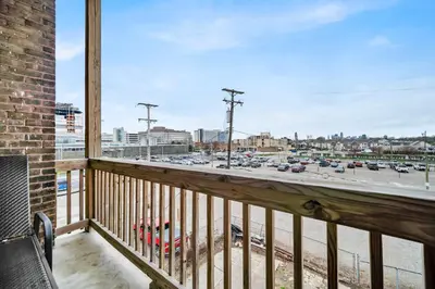 a balcony with a view of a parking lot at Cle Suites 2BR 1BA 5 min Walk to Cle Clinic #9 in Cleveland