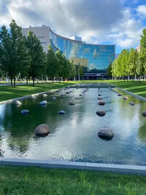 a pond in a park with rocks in the water at Cle Suites 2BR 1BA 5 min Walk to Cle Clinic #12 in Cleveland