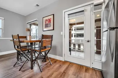 a dining room with a table and chairs at Cle Suites 2BR 1BA 5 min Walk to Cle Clinic #12 in Cleveland