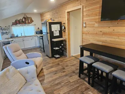 a living room with a couch and a table at College Park Bungalow in Winchester