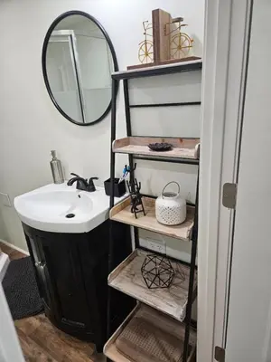 a bathroom with a sink and a mirror at College Park Bungalow in Winchester