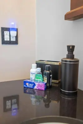 a counter top with toiletries on top of it at College Park Getaway in Winchester