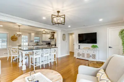 an open kitchen and living room with a large island at Screened Patio and Fire Pit Modern Westerville Home in Westerville