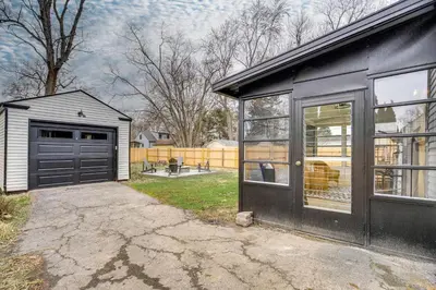 a house with a garage and a driveway at Screened Patio and Fire Pit Modern Westerville Home in Westerville