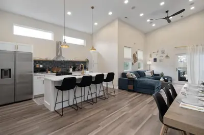 a kitchen and living room with a couch and a table at Modern Lake House 3 Blocks from the Lake! in Buckeye Lake