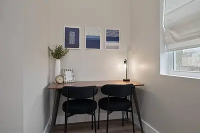 a small table in a room with two chairs at Modern Lake House 3 Blocks from the Lake! in Buckeye Lake