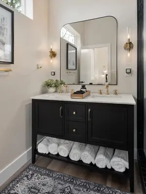 a bathroom with a sink and a mirror at Modern Lake House 3 Blocks from the Lake! in Buckeye Lake