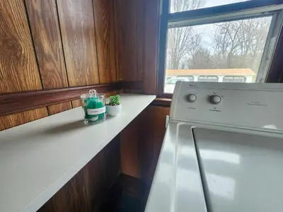 a kitchen with a stove and a window at The Farmhouse in Elyria, OH in Elyria