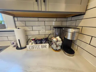 a coffee bar sign on a counter in a kitchen at The Farmhouse in Elyria, OH in Elyria