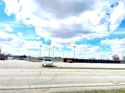 a white car is parked in a parking lot at Emerald - GREAT PARK, 3br, Yard, Pet-Friendly in Paulding