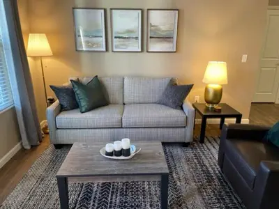 a living room with a couch and a table at The Hilliard Executive No Steps Luxury Beds in Dublin