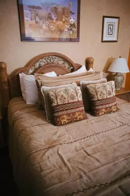 a bedroom with a large bed with pillows at The Inn at Dresden in Dresden