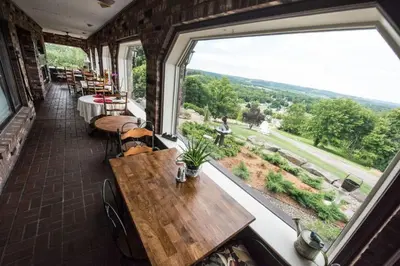 a room with a table and a large window at The Inn at Dresden in Dresden