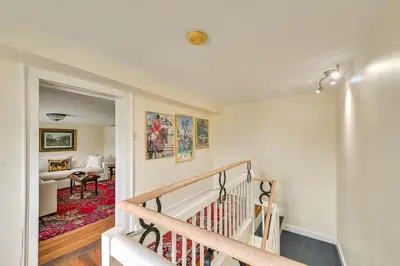 a staircase leading to a living room with a couch at Georgetown Home Near Kentucky Horse Park! in Georgetown