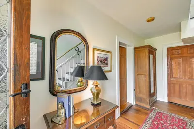 a room with a mirror and a table with a lamp at Georgetown Home Near Kentucky Horse Park! in Georgetown