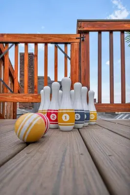 a group of bowling balls and a ball on a deck at Lofts on 4th Penthouse, Sleeps 14, 2 units in Cleveland