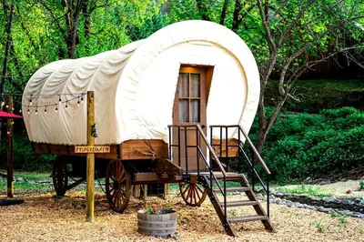 a yurt on display with a ladder at Ohio Glamping Destination in this Covered Wagon in Arcanum