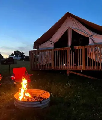 a fire pit in front of a gazebo at Impressive Tented Cabin with Peaceful Vistas and Fire Pit in Logan, Ohio in Logan