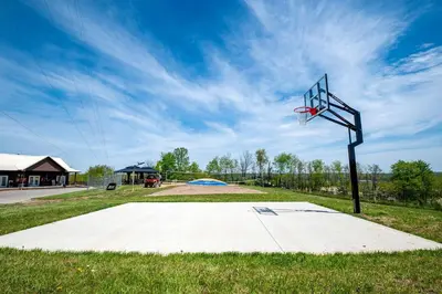 a basketball hoop in the middle of a park at Cozy Tented Cabin with Fire Pit and Barbecue in Logan, Ohio in Logan