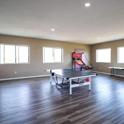 an empty room with a ping pong table in it at Beautiful Tented Cabin Nestled Amidst Trees with Incredible Hiking Trails Near in Logan, Ohio in Logan