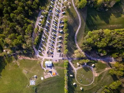 an aerial view of a parking lot with parked cars at Charming Tented Cabin Placed in a Selcuded Area in Logan, Ohio in Logan