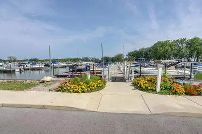 a marina with a bunch of flowers and boats at Furnished Screened Porch Baypoint Resort Home! in Marblehead