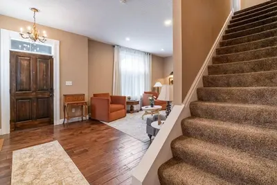 a staircase in a home with a living room at 4 Bedroom Luxe home in Brewery District in Columbus