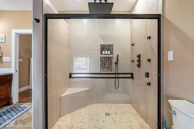 a shower with a glass door in a bathroom at 4 Bedroom Luxe home in Brewery District in Columbus