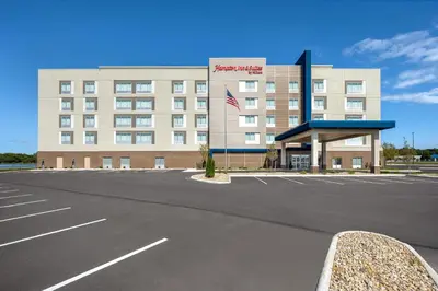 an empty parking lot in front of a hotel at Hampton Inn & Suites By Hilton Port Clinton Catawba Island in Port Clinton