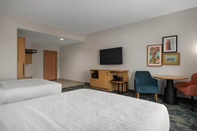 a hotel room with two beds and a flat screen tv at Hampton Inn & Suites By Hilton Port Clinton Catawba Island in Port Clinton
