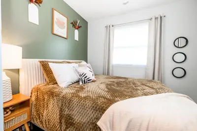 a bedroom with a bed and a window at Meadow View BNB in Lima