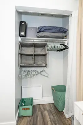 a walk in closet with towels and a basket at Meadow View BNB in Lima