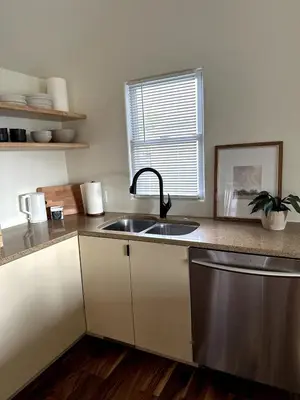 a kitchen with a sink and a window at Scandanavian Cottage with a View in Canonsburg