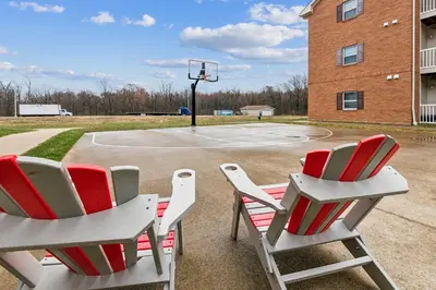 two chairs sitting in front of a basketball court at Spacious and Modern Stay to Relax & Recharge in Mansfield