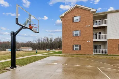 a basketball hoop in front of a building at Bright and Connected Your Ideal Getaway in Mansfield